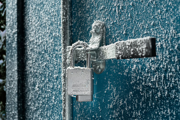 Padlock on frozen shipping container